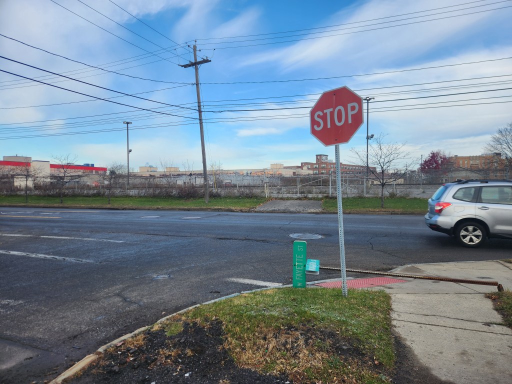 Someone knocked the street sign for the intersection of Marcellus Street and West Fayette Street over in Syracuse, New York. At least it was a sunny day.